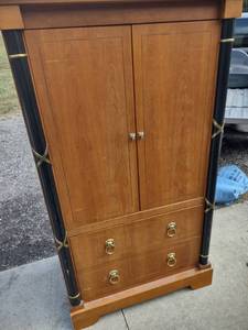 lot 849 image: entertainment center with two drawers lion heads and hideaway doors 39 in wide 25 inches deep 66 in tall