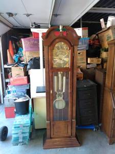 lot 871 image: Ridgeway grandfather clock working chimes on the quarter hour 22 and 12 in wide 12-in deep 79 in tall has brass pineapple on top