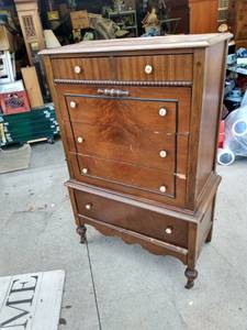 lot 890 image: antique chest on chest out of the Muehlebach hotel date on back is 10 14 of 27 needs one wheel replaced is 34 in wide 19 in deep 54 in tall
