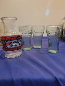 lot 3487 image: Coca-Cola pitcher and 3 Coca-Cola glasses