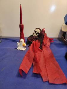 lot 3502 image: Ghost and red candle holder