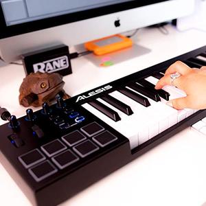lot 20965 image: Alesis V49 - 49 Key USB MIDI Keyboard Controller with 8 Backlit Pads, 4 Assignable Knobs and Buttons, Plus a Professional Software Suite Included
