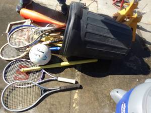 lot 1709 image: Trash can w sporting goods- Tennis rackets & misc.