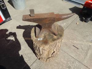 lot 1744 image: Antique Trenton 102# Anvil on tree stump- Made in The USA includes the blade piece-