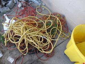 lot 1794 image: Lot of various extension cords- Yellow cord is heavy duty & long-