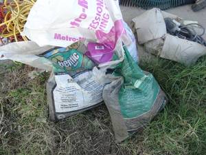 lot 1795 image: 2 partial bags of mulch & partial bag of growing mix