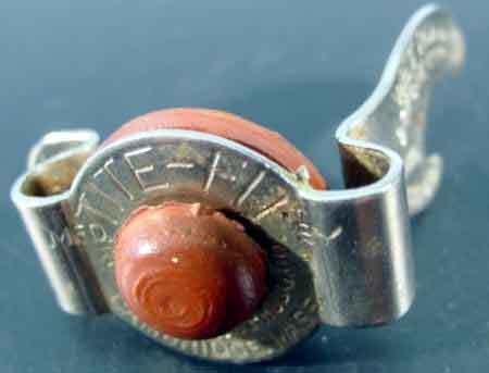 lot 8996 image: WOW a Tite Fit glass bottle opener and fizz stopper most likely from the 40s or 50s.