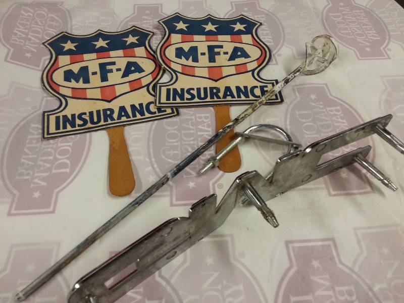 lot 8924 image: A pair of old MFA insurance had fans given out at the state fair 50 years ago, Big GMC hood or grille ornament,