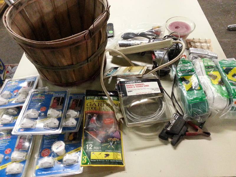 lot 8915 image: Big assortment of just stuff.  Bunch of these Magnetic Tot Loks, animal run cable, fabric lawn chair repair kits
