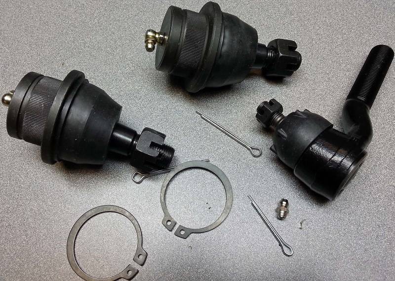 lot 8909 image: Pair of new replacement ball joints and a single tie rod end with snap rings.  Sorry no box or part numbers.