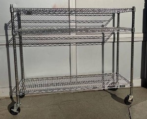 lot 5855 image: 4 foot Metro shelf with 3 shelves on locking casters