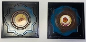 lot 21636 image: lot of two metal frames , with artwork