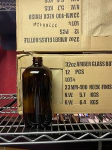 lot 21688 image: A lot of 21 , 32 ounce amber glass bottles