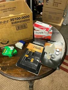 lot 21693 image: miscellaneous box with batteries sharpies paper clips staples and magic tape roll