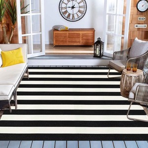 lot 4006 image: Better Homes & Gardens 7 X 10 Black and White Striped Outdoor Rug
