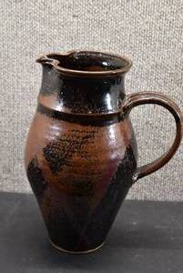 lot 5352 image: Red Clay Pitcher With Signature On Bottom  10 x 7
