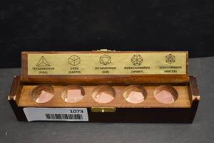 lot 1073 image: 5 Piece Set Sacred Geometry Rose Quartz Stones in Case.  Stones Less Than 1 Case 7 58x1 12x1 14