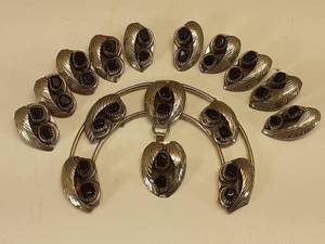 lot 7017 image: Lot of 11 Black Stone Silver Tone Necklace Pieces  Squash Blossom Motif