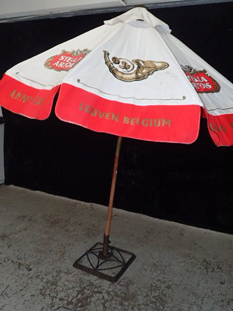lot 9007 image: Stella Artois Umbrella with Iron Base