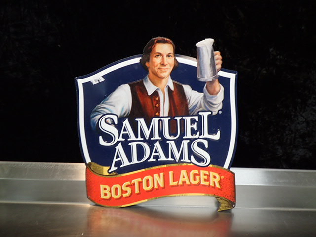 lot 9184 image: Sam Adams Metal Wall Art
