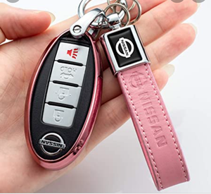 lot 4574 image: Pink leather Nissan key fob varies from stock photo