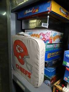 lot 1127 image: Chiefs Cushion & Lot of Kids Games and Misc