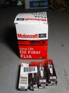 lot 1168 image: Oil Filter and Spark Plugs