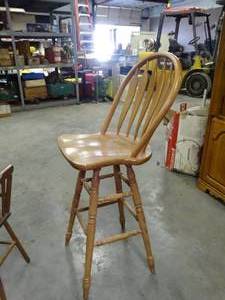 lot 1192 image: Adult Sized Rotating Wood Bar Stool