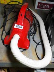 lot 1379 image: Small Electric Dirt Devil Vacuum