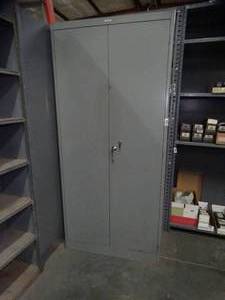 lot 1515 image: 78 tall 2 Door Metal Cabinet w Boxes inside