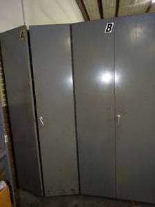 lot 1612 image: Metal storage cabinet Connected to and Includes a few open Shelving units (18Ft Long Total) (Not Pictured)