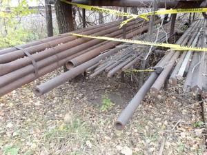 lot 1906 image: Bottom Row of Solid and Hollow Core Steel Rods Variety Diameters  Rack Not Included