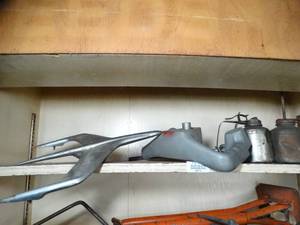 lot 29710 image: Contents on Shelf - Hood Ornament and Plane Controller - Oil Cans