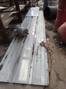 lot 1921 image: 2 Pieces of Roofing Metal