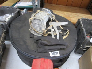 lot 1614 image: Dust mask and round zipper case with mic chord