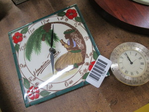 lot 1704 image: Small brass clock and ceramic wall clock from Hawaii