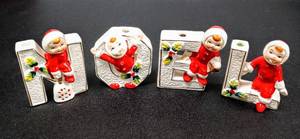 lot 28100 image: 1960s Lipper & Mann NOEL Christmas Snowbabies Ceramic Letters - 4 Tall Candle Holders