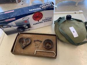 lot 56 image: Antique Water Canteen, Flashing Garage Parking Signal, and Harras Cast Iron Baking Molds