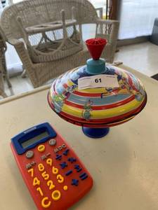 lot 61 image: Schylling Toys Circus Spinning Top & Child World Calculator
