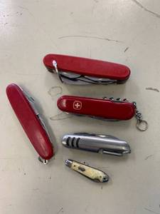 lot 97 image: Red Pocket Knives, miniature and small.
