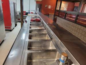 lot 33653 image: 17 Hole Steam Table - 240 Volts with Sneeze Guard and Stainless Steel Plate Shelf