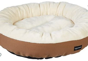 lot 1175 image: Amazon Basics Round Bolster Dog or Cat Bed with Flannel Top