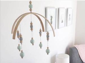lot 696 image: Wooden Pearl Baby Girl Mobile