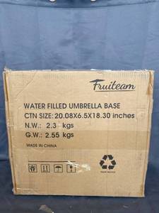 lot 1725 image: FRUITEAM PATIO UMBRELLA BASE 50 LBS