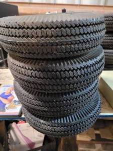lot 167 image: TIRES WITH PLASTIC RIMS 4.10 X 3.50 (LOT OF 4)