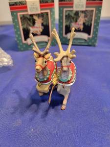lot 5011 image: Four Hallmark keepsake Comet and Cupid ornaments