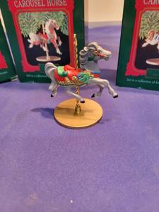 lot 5017 image: Four Hallmark Carousel horses ornaments