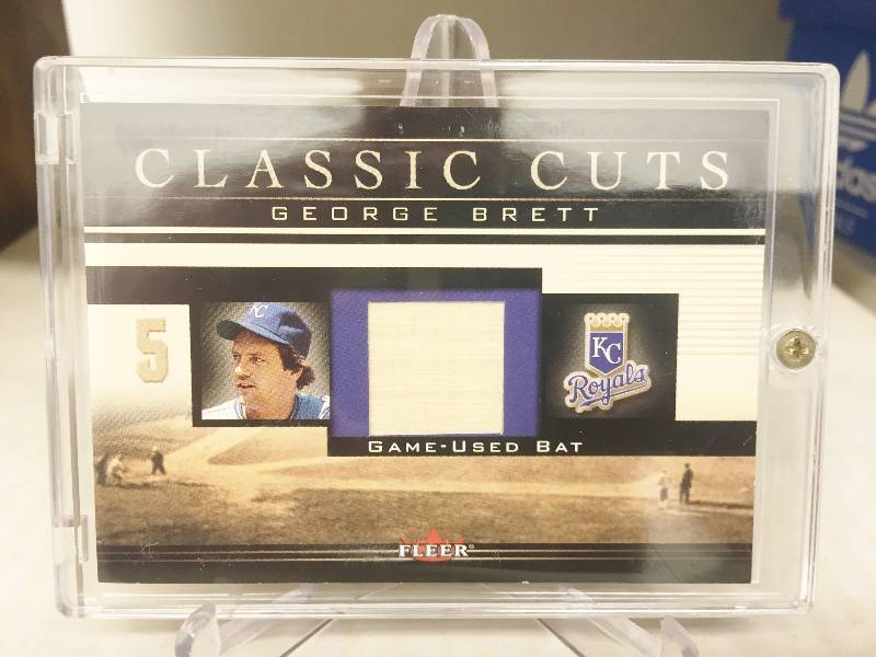 lot 1015 image: George Brett Game Used Bat Card - 2002 Fleer Classic Cuts Containing An Actual Piece From George Brett Game Used Bat