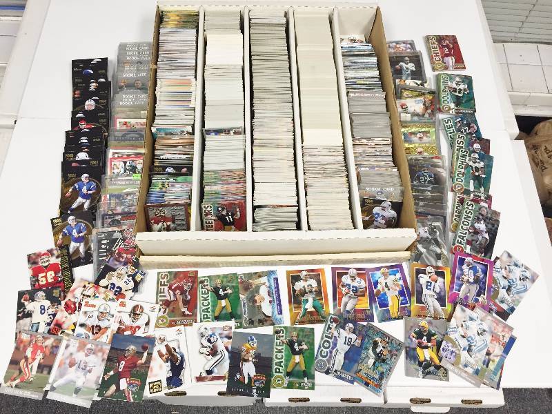 lot 1063 image: 5,000 Count Box Jam Packet With Football Superstars - Rookies - Inserts & More - Book Value Over $500 - A True Treasure Hunt