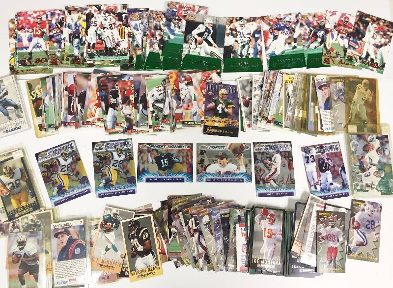 lot 1088 image: Mega Lot of (250)  Oversized Football Cards Loaded w Stars  Inserts Joe Montana, Emmitt Smith, Bart Starr, Favre, Elway 